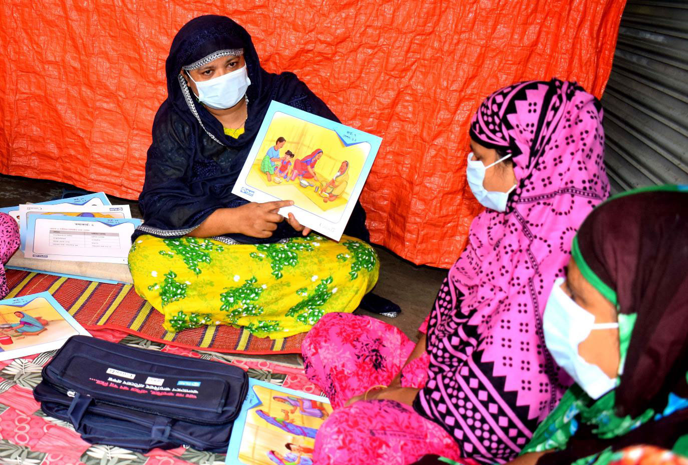 Adolescent girls participate in a session
                        on self-confidence, communication, problem-solving and asserting their rights.