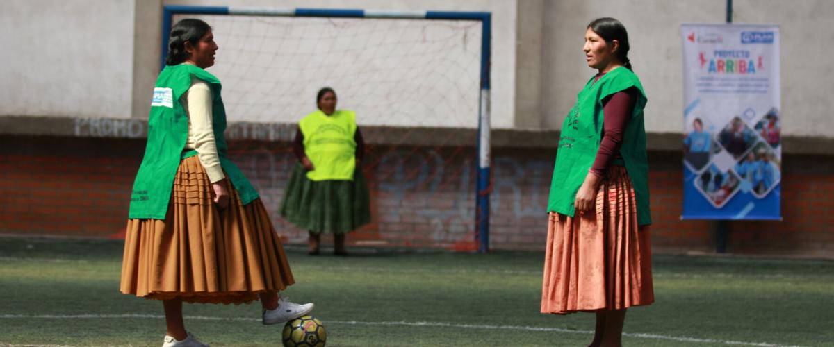 two girls playing football