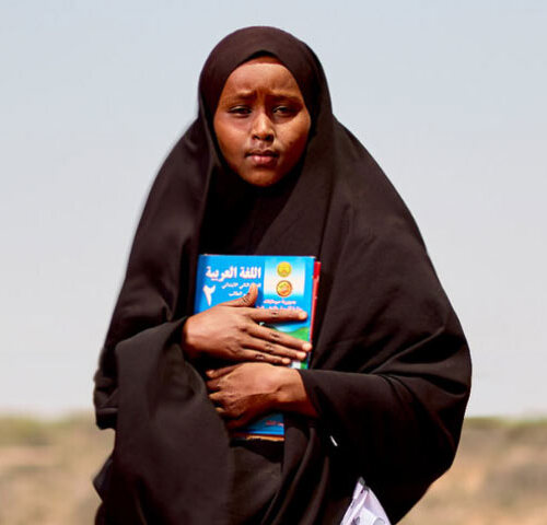 Woman holding books