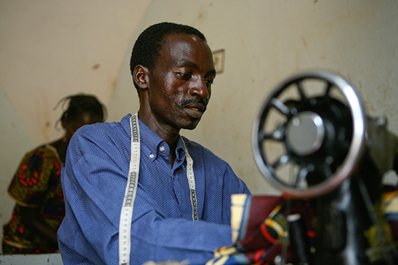 A man sewing