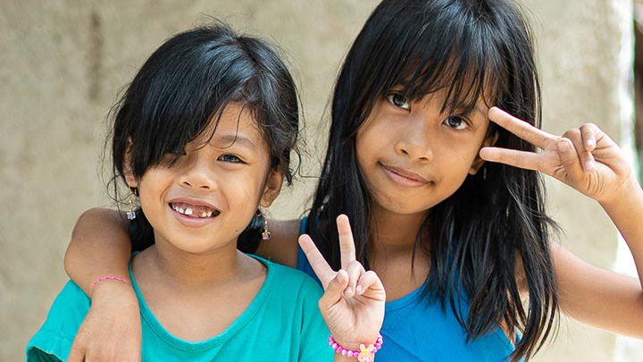 Girls showing peace sign