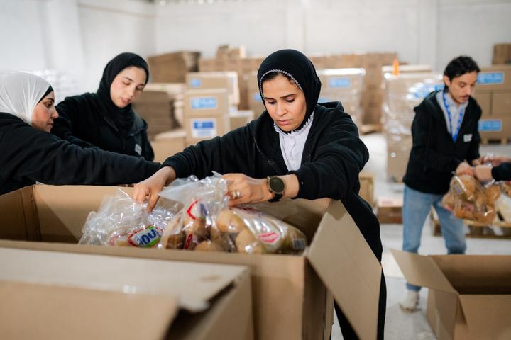 Plan Egypt staff prepare relief aid for transportation to Gaza