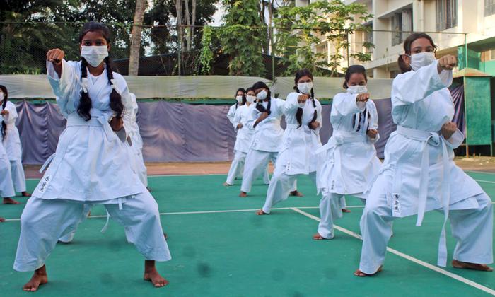 A group of girls practise stances in a karate self-defence class provided through Plan International Canada’s Combatting Early Marriage in Bangladesh project, run in partnership with the Government of Canada and Because I am a Girl supporters.