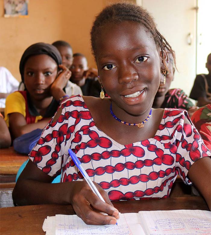 Djèguè, 12, learning in class at her school in Bougouni region.