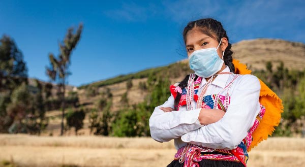 Girl in mask with arms crossed