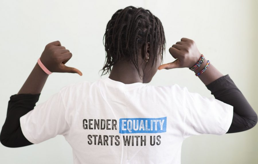 Girl pointing to message on her t-shirt