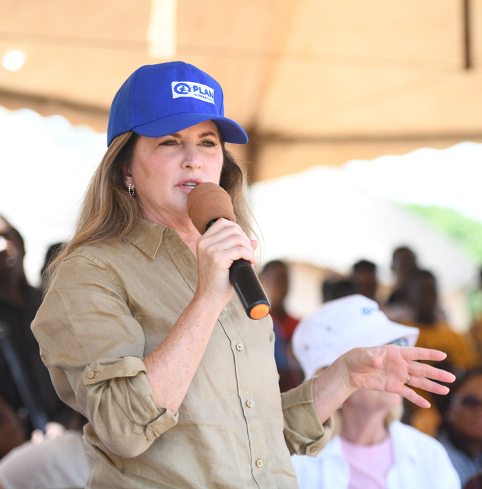 photo of Rona Ambrose, Board Chair of Plan International Canada speaking with a mic 