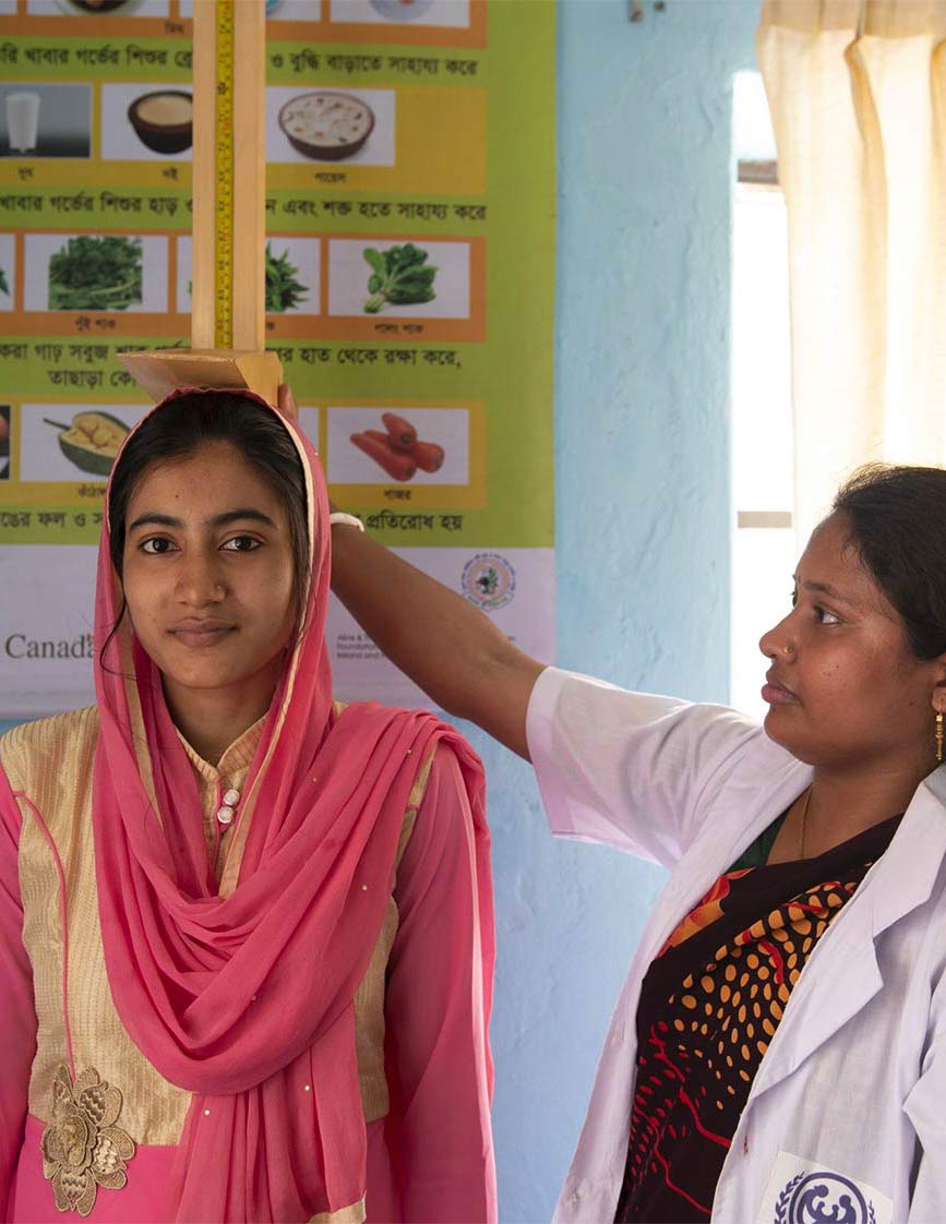 Girls height being measured