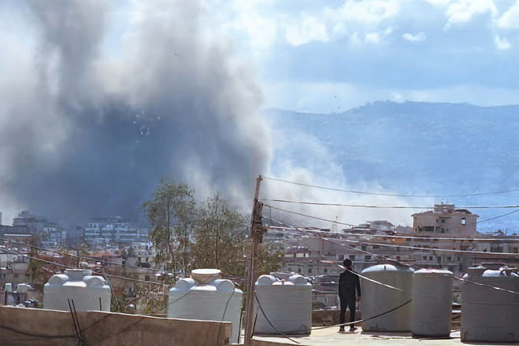 Young person looking across the devastation in his town