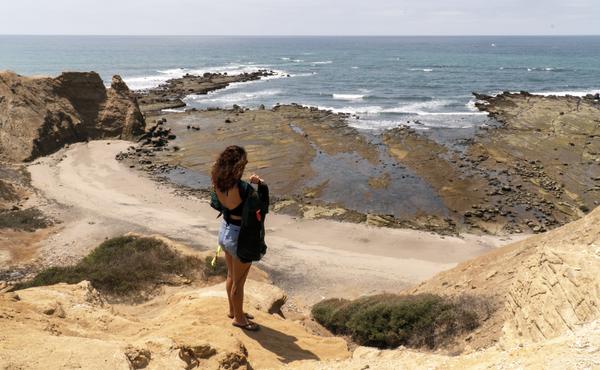 Sandra looks at the ocean view near her home in Santa Elena, Ecuador.