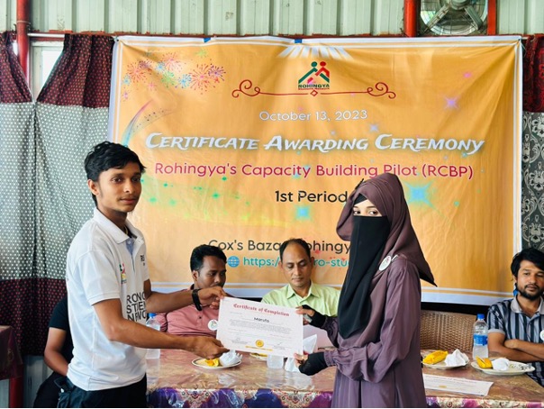 A young man and a teenage girl standing side-by-side for Eid celebrations.