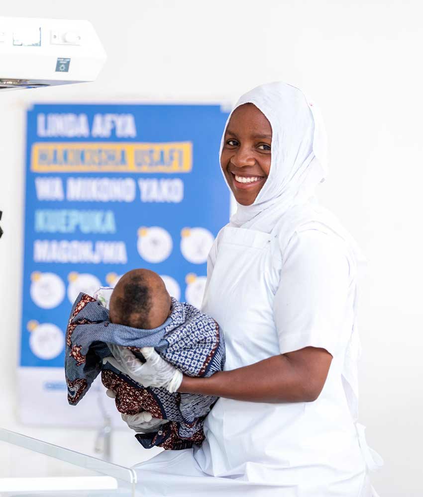 Nurse holding a baby