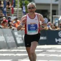 A photo of a man running in a marathon