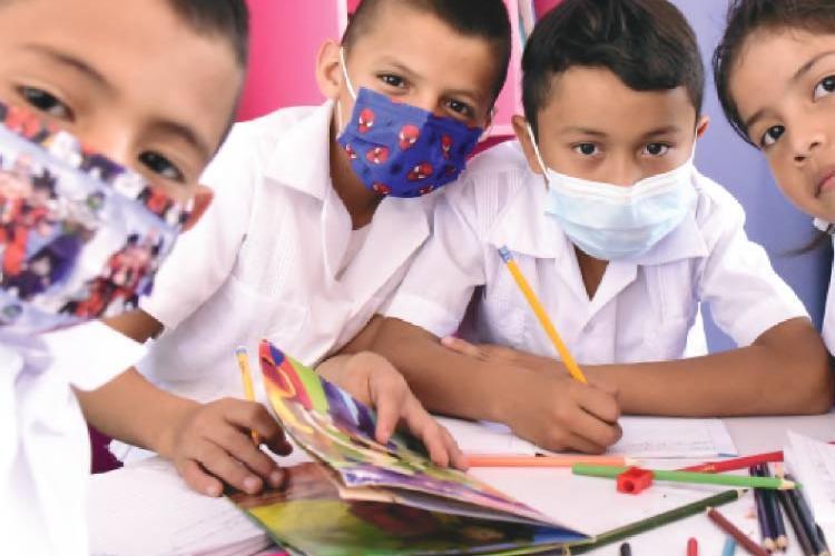 Children participating in a group art project