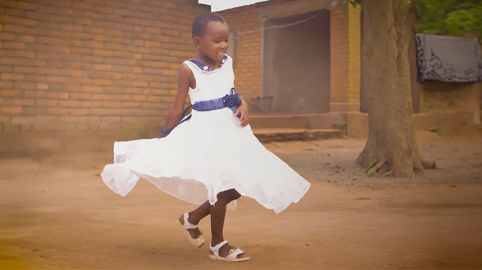 Picture of girl in a white dress spinning