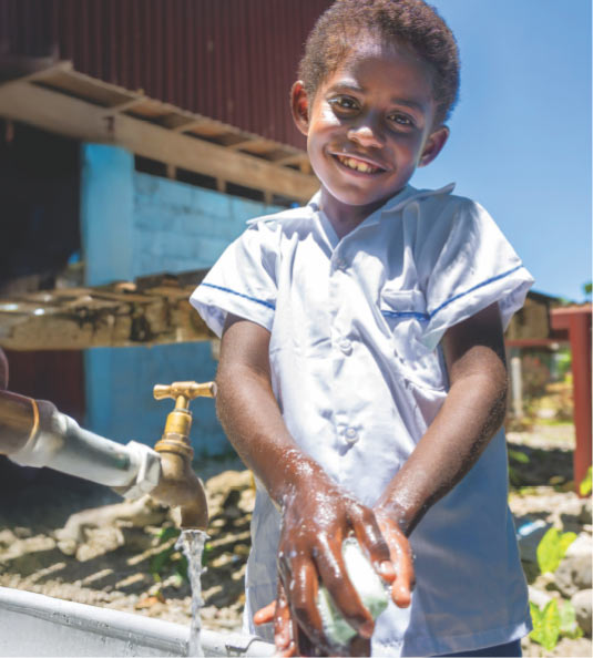 Boy washing hands