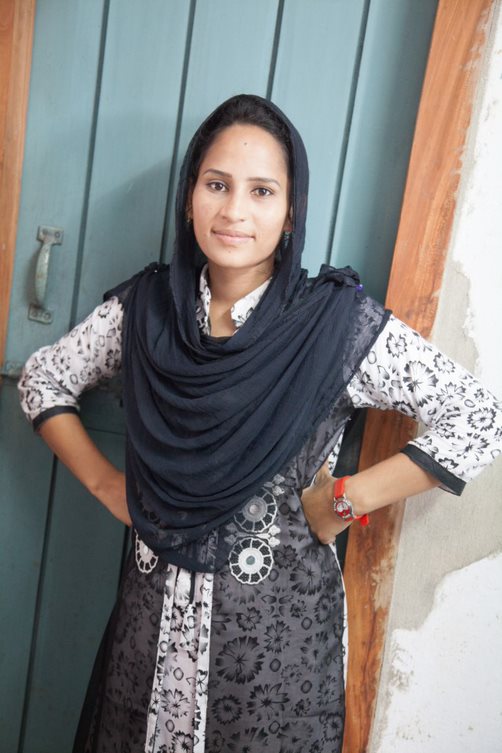 girl student from Bangladesh stand with arms on hips