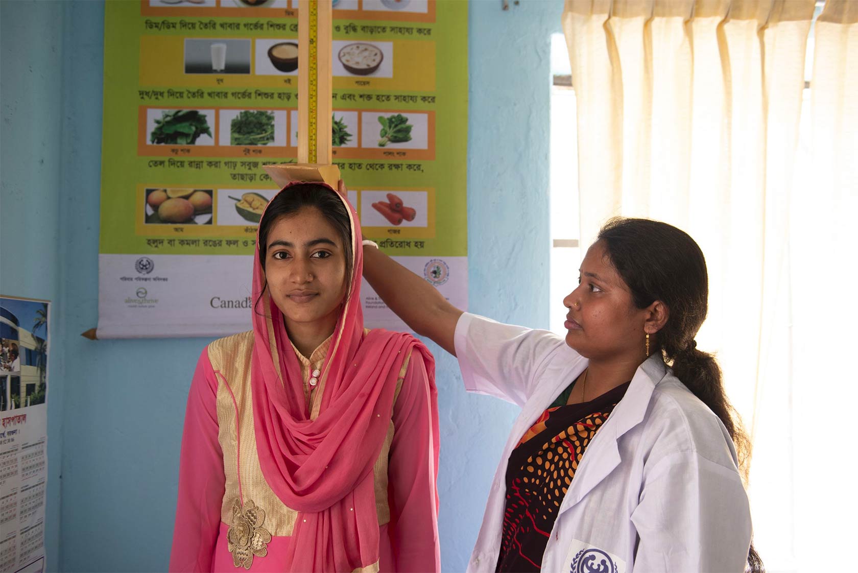 Girls height being measured