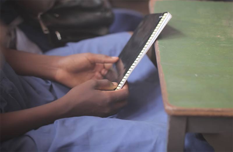 Girl holding notebook