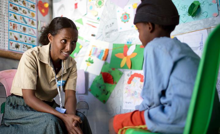 Nechi counsels a young boy at the child friendly space, Mental health support for children, GOH, FY24