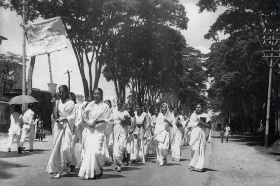 A black-and-white photo showing women in saris marching in Dhaka, Bangladesh, on February 21, 1952.