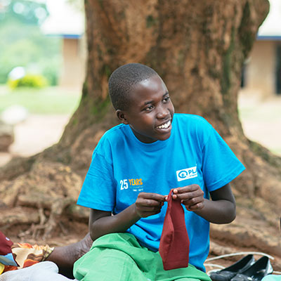 A girl in Uganda takes part in a training on making reusable pads