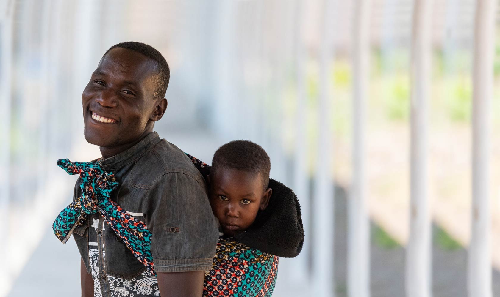 Father carrying child